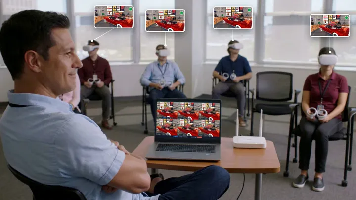 A trainer watches learners in VR headsets; the same app runs on every headset and on the laptop running OmnicastVR, next to a Wi-Fi router